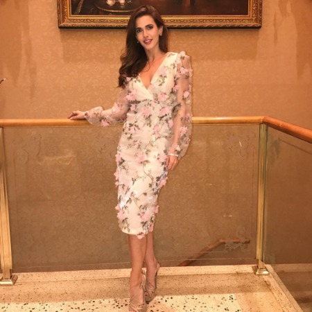 Kathryn Kohut stands at a height of  5 feet 7 inches.